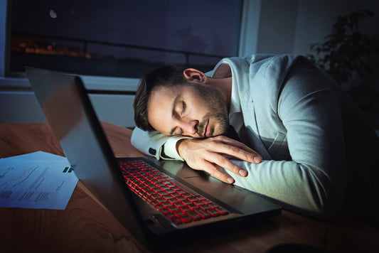 Businessman sleeping on laptop