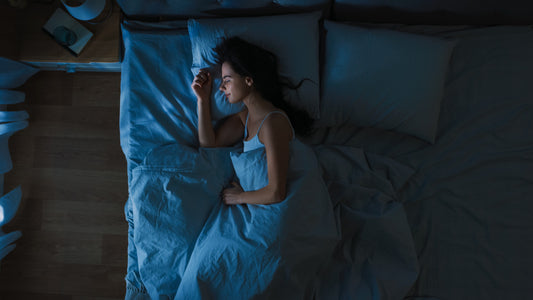 Young woman sleeping soundly in bed